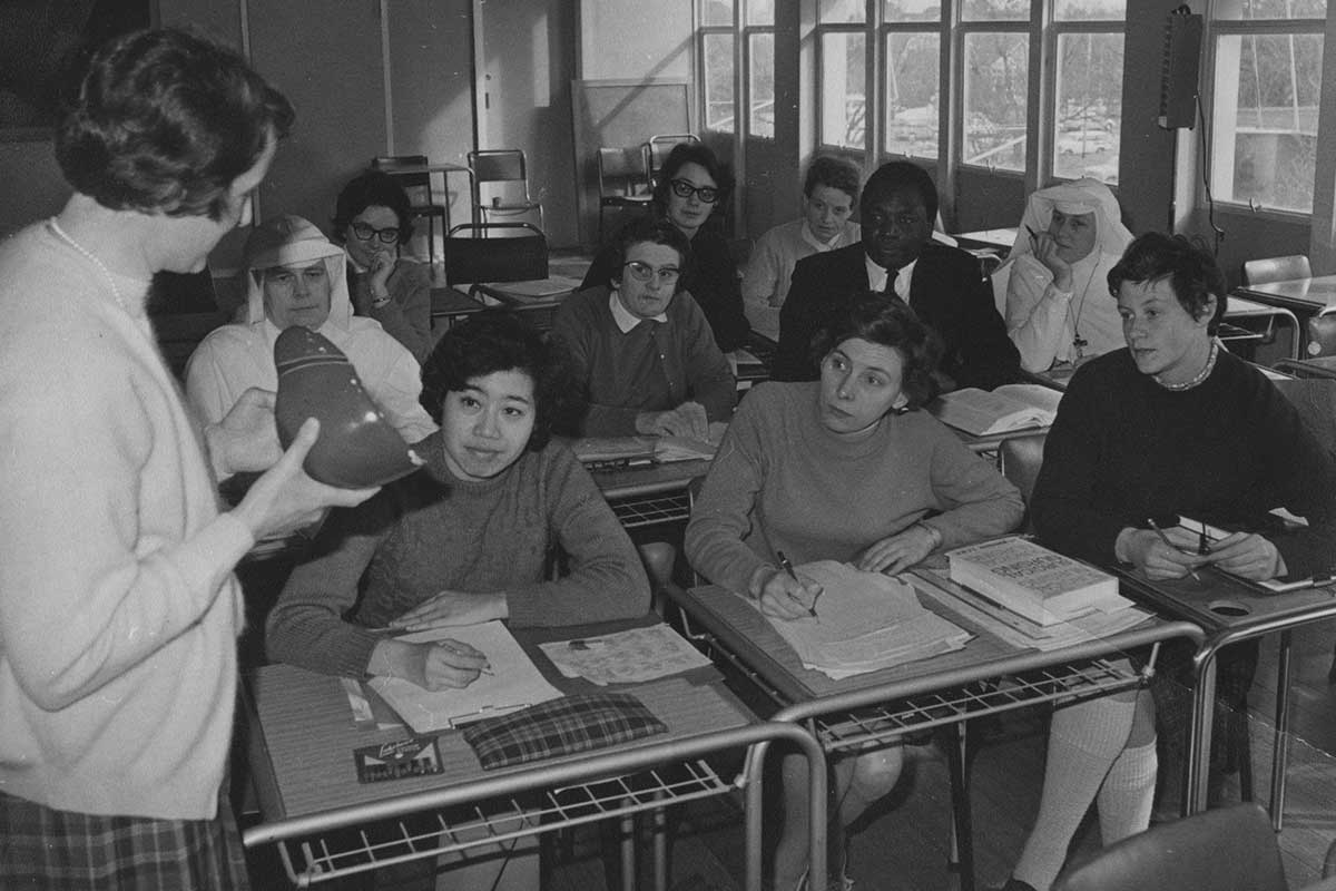 Nurse Educator Marjorie Hodgson and her students in a crowded classroom in 1968