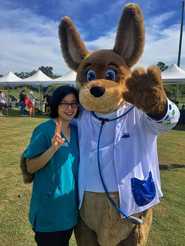 Wenjia volunteering at a North Coast Aboriginal Corporation for Community Health event